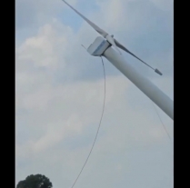 Farmers in Germany destroy windmill with tractors photo